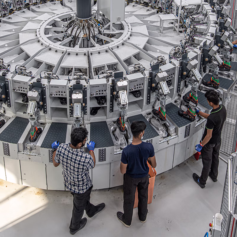 Automated production line assembling safety shoes, where precision engineering meets durable design—built to deliver consistent protection in demanding work environments.